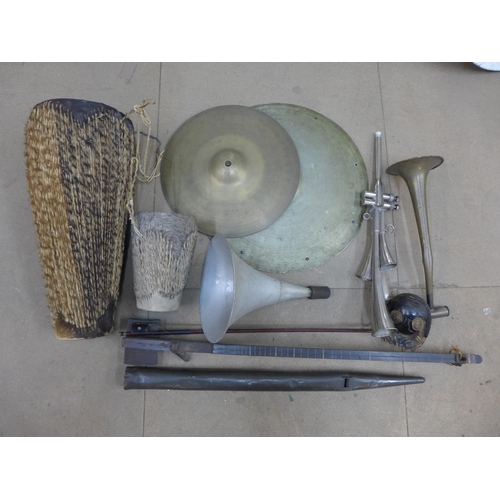 386 - A phono fiddle, two bongos and cymbals, an organ pipe and percussion intruments