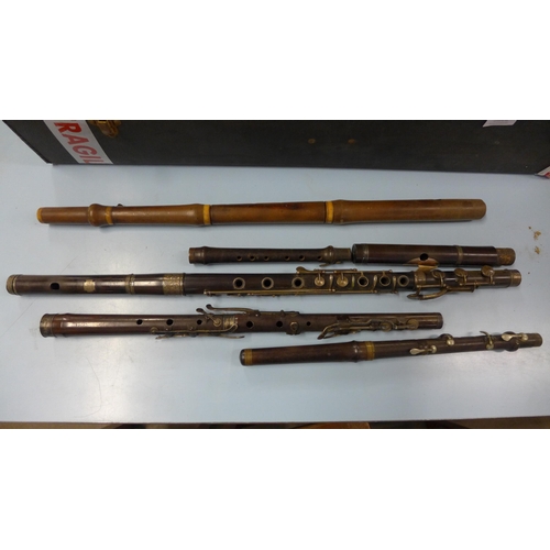 392 - A case containing two flutes and sections of flutes