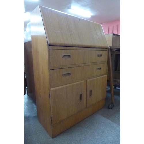 84 - A teak trolley and a teak bureau