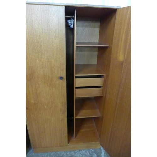 87 - A pair of teak wardrobes