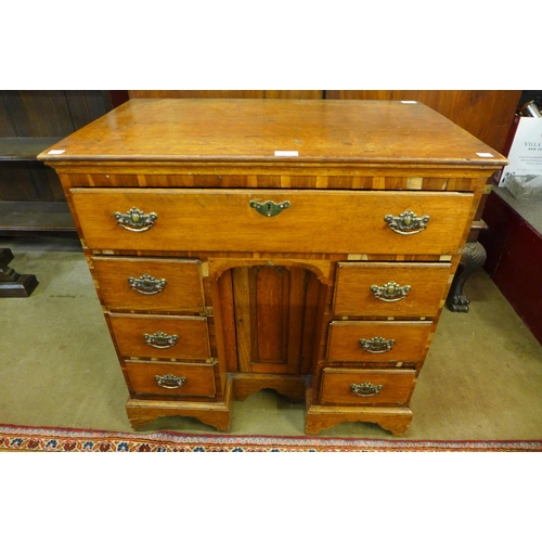 35 - A George II oak kneehole desk