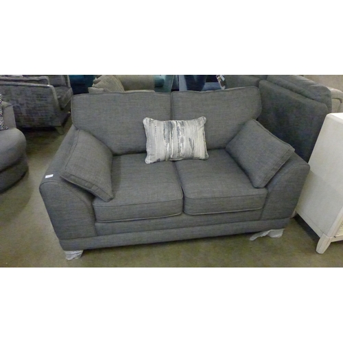 1357 - A charcoal upholstered two seater sofa