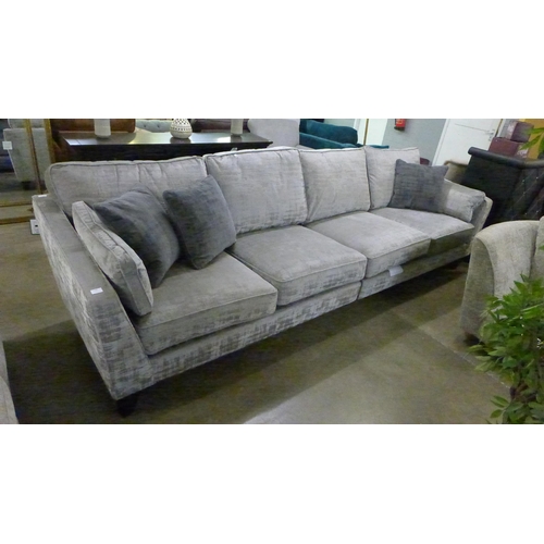 1377 - A silver and bronze velvet five seater sofa