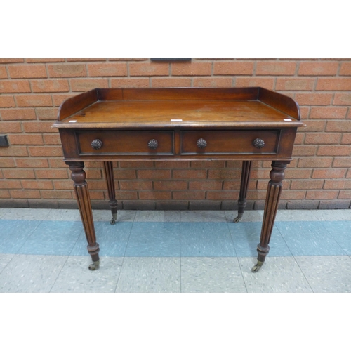 1 - A George IV mahogany two drawer writing table, manner of Gillows, Lancaster, 83cms h, 91cms w, 51cms... 