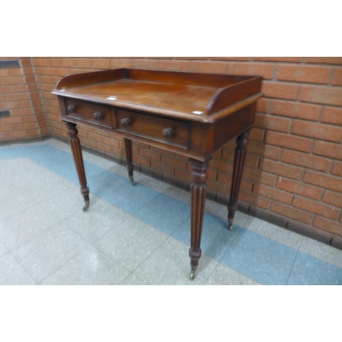 1 - A George IV mahogany two drawer writing table, manner of Gillows, Lancaster, 83cms h, 91cms w, 51cms... 