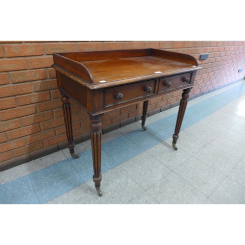 1 - A George IV mahogany two drawer writing table, manner of Gillows, Lancaster, 83cms h, 91cms w, 51cms... 