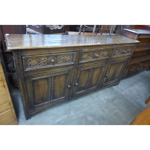 104 - A 17th Century style carved Ipswich oak dresser