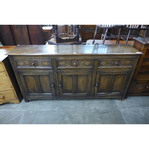 104 - A 17th Century style carved Ipswich oak dresser