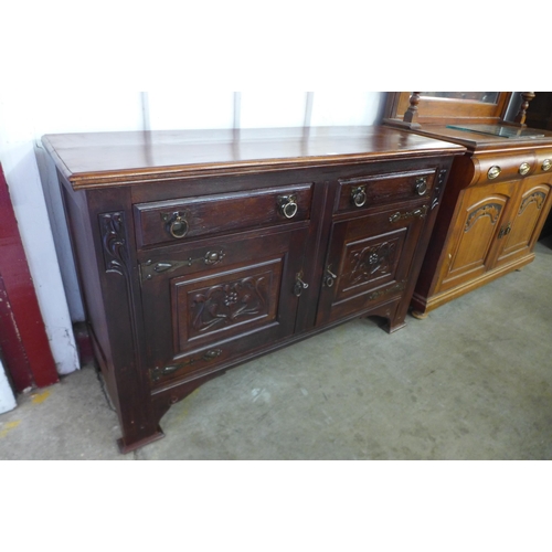 113 - An Arts and Crafts mahogany sideboard