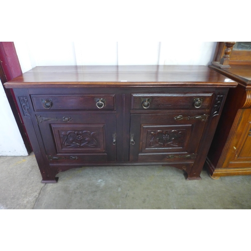 113 - An Arts and Crafts mahogany sideboard