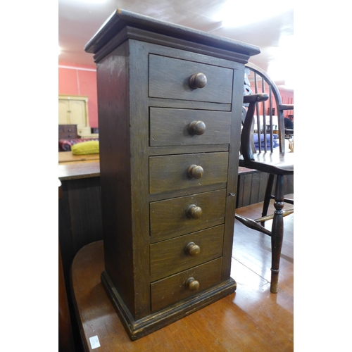 115 - A small Victorian pine table top Wellington chest