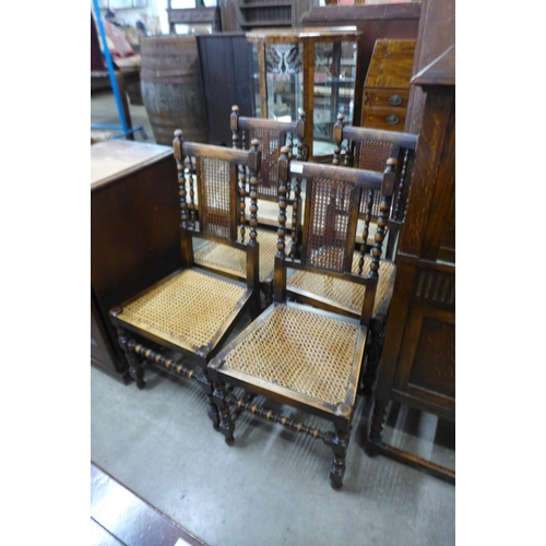 119 - A set of four early 20th Century beech bergere dining chairs