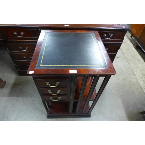 127 - A mahogany revolving bookcase