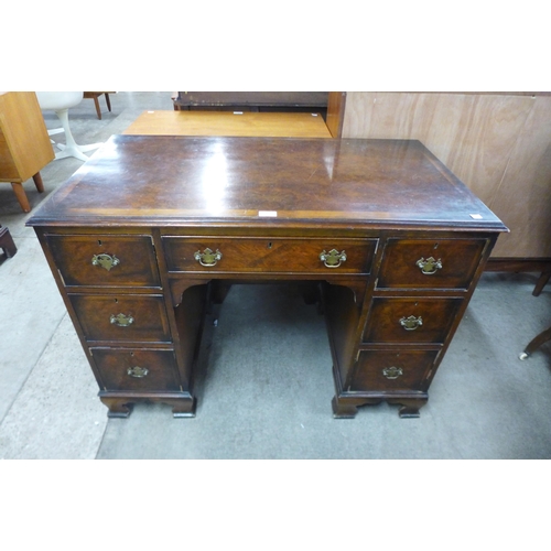 130 - A George III style burr walnut desk