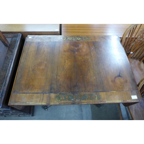 139 - A Regency rosewood and brass inlaid sofa table