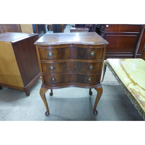 156 - A small mahogany serpentine chest of drawers