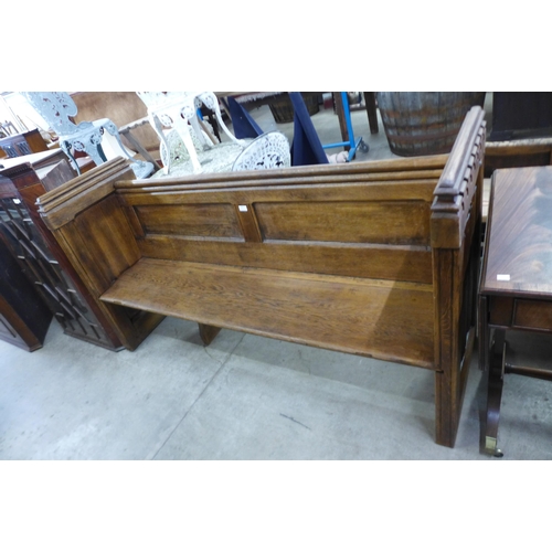 160 - A Victorian carved oak linenfold church pew