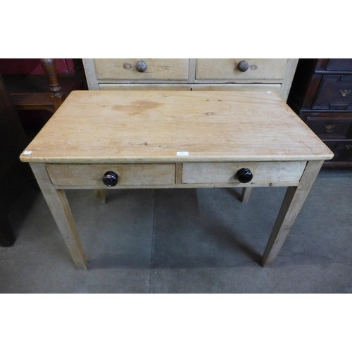 17 - A Victorian pine scrub top two drawer kitchen table, 76cms h, 105cms w, 59cms d