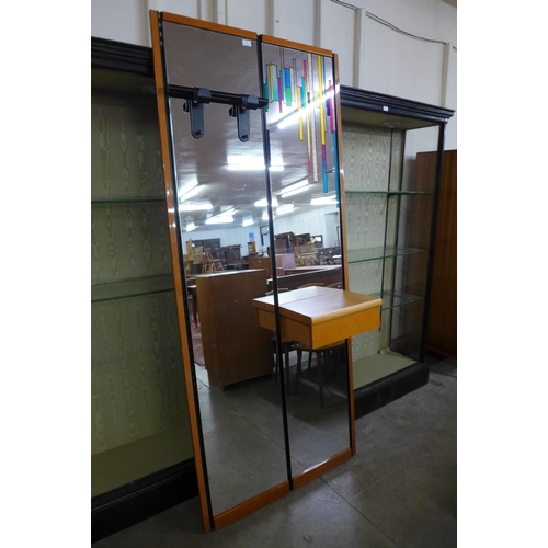 177 - A large contemporary Italian mirror with coat hooks