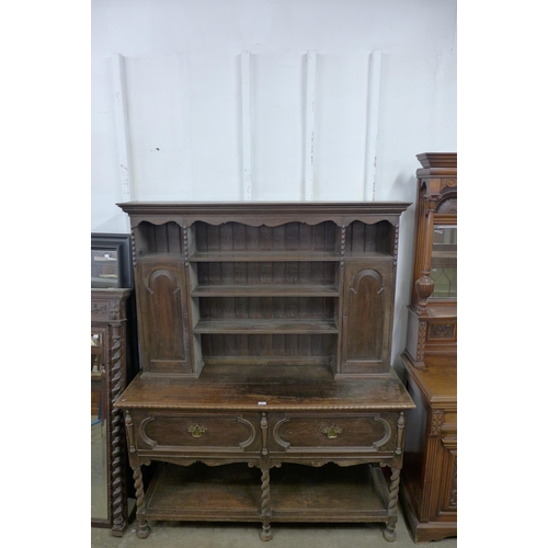 199 - An early 20th Century Jacobean Revival carved oak dresser