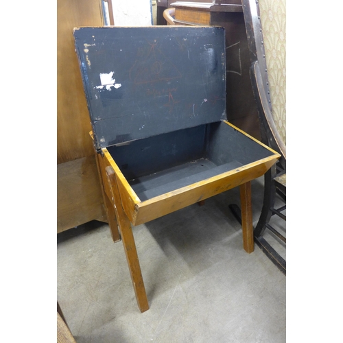 214 - A child's pine school desk and two chairs