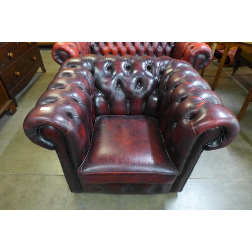 24 - An oxblood leather Chesterfield club chair