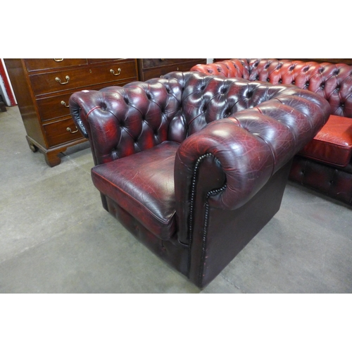 24 - An oxblood leather Chesterfield club chair