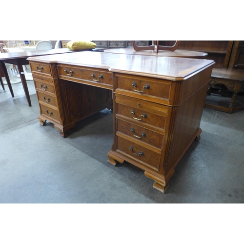 32 - A George III style elm and walnut library desk