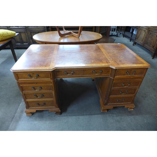 32 - A George III style elm and walnut library desk