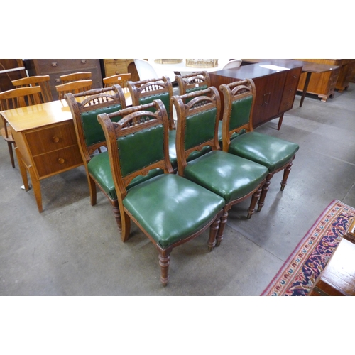 38 - A set of six Victorian Aesthetic Movement carved oak and green leather chairs