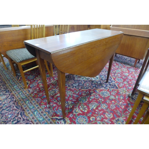 52 - A teak drop leaf table