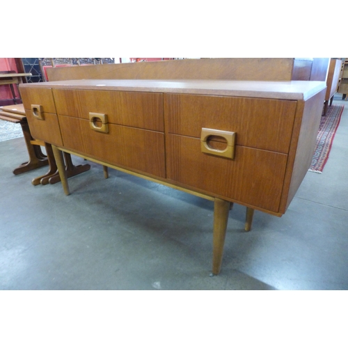 59 - A teak six drawer sideboard