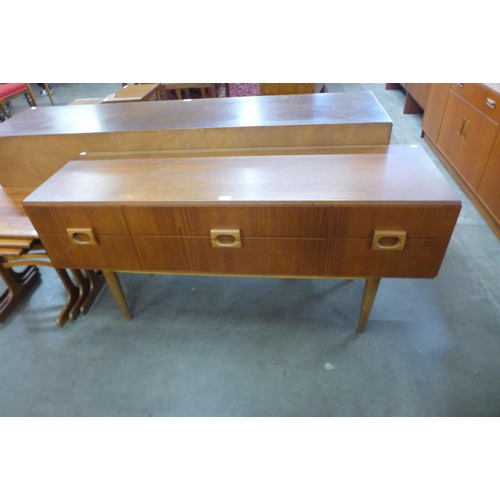 59 - A teak six drawer sideboard