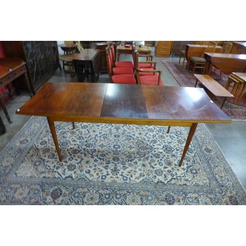 62 - A Uniflex afromosia extending dining table