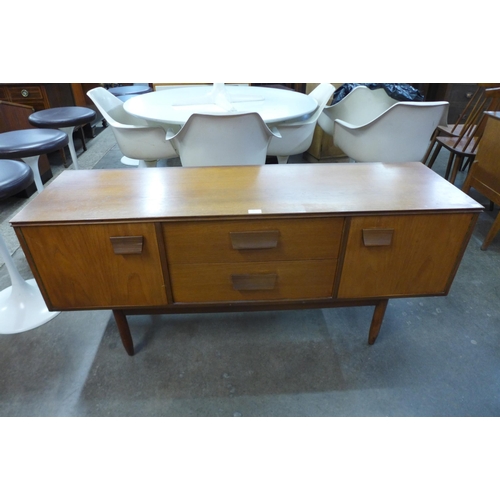 65 - A small teak sideboard