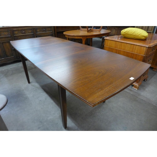 68 - A Vanson mahogany extending dining table