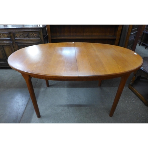 69 - A McIntosh teak extending dining table