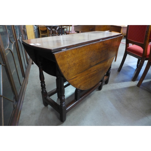 8 - A George III oak gateleg dining table