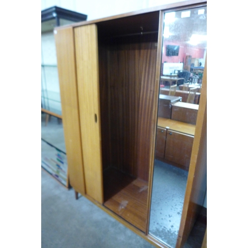 95 - An Austin Suite teak wardrobe