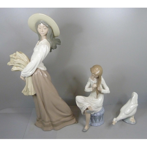 614 - Three Nao by Lladro figures, girl sitting a/f