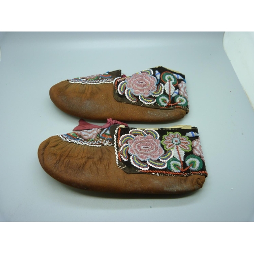 615 - A pair of Native American Iroquois beaded hide moccasins, late 19th Century