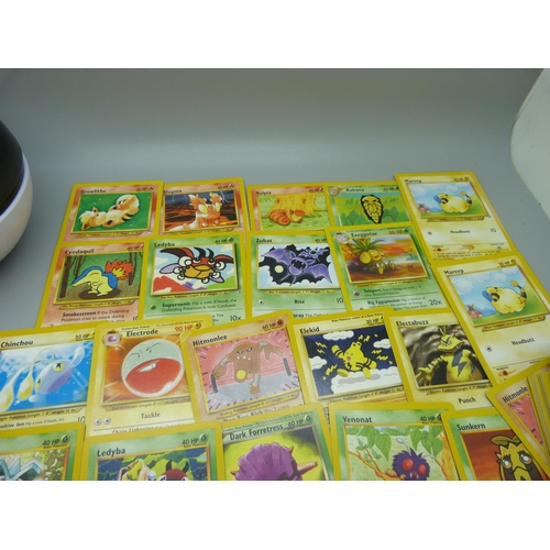 617 - Eighty 1995-2000 Pokemon cards, in Pokeball tin