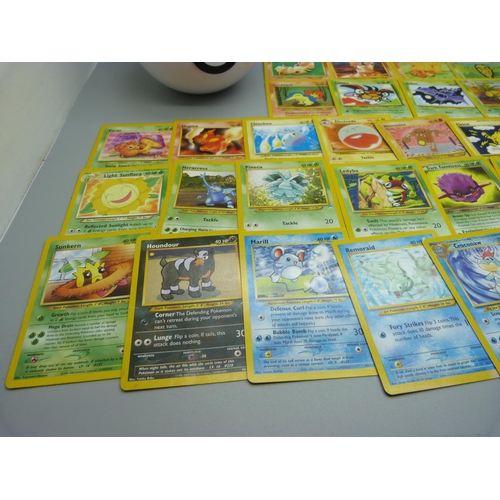 617 - Eighty 1995-2000 Pokemon cards, in Pokeball tin