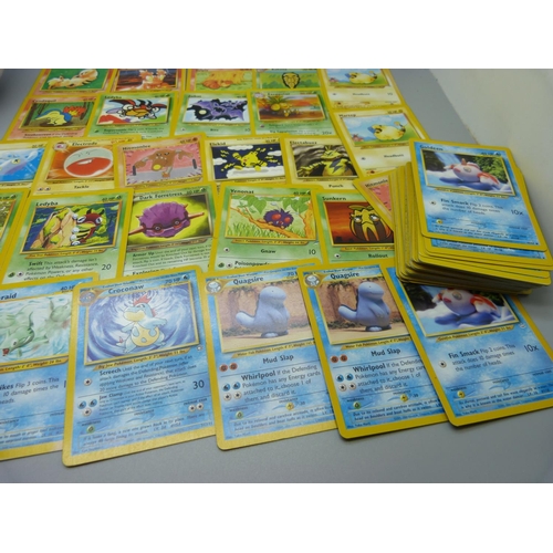 617 - Eighty 1995-2000 Pokemon cards, in Pokeball tin