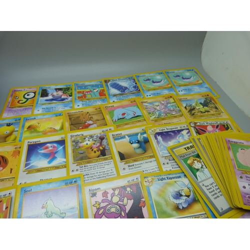 617 - Eighty 1995-2000 Pokemon cards, in Pokeball tin