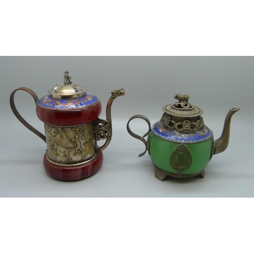 620 - Two small oriental tea pots with enamel detail