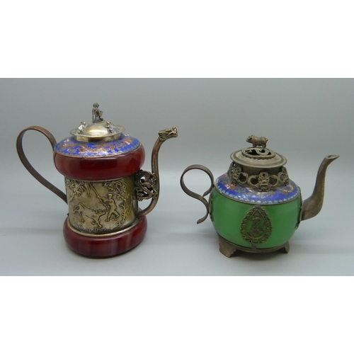 620 - Two small oriental tea pots with enamel detail