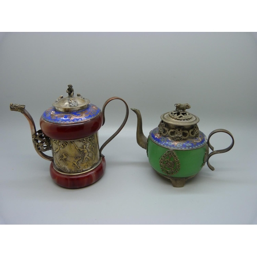 620 - Two small oriental tea pots with enamel detail