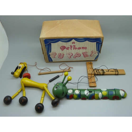 635 - A Pelham puppet caterpillar, boxed, and a Pluto puppet