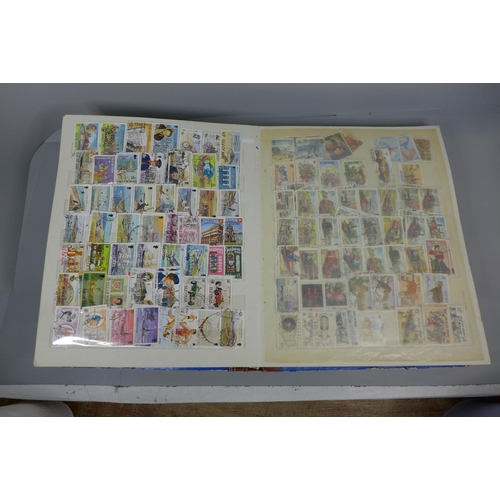 669 - Three stamp albums including Malaysia, India, Guernsey, Isle of Man, etc.